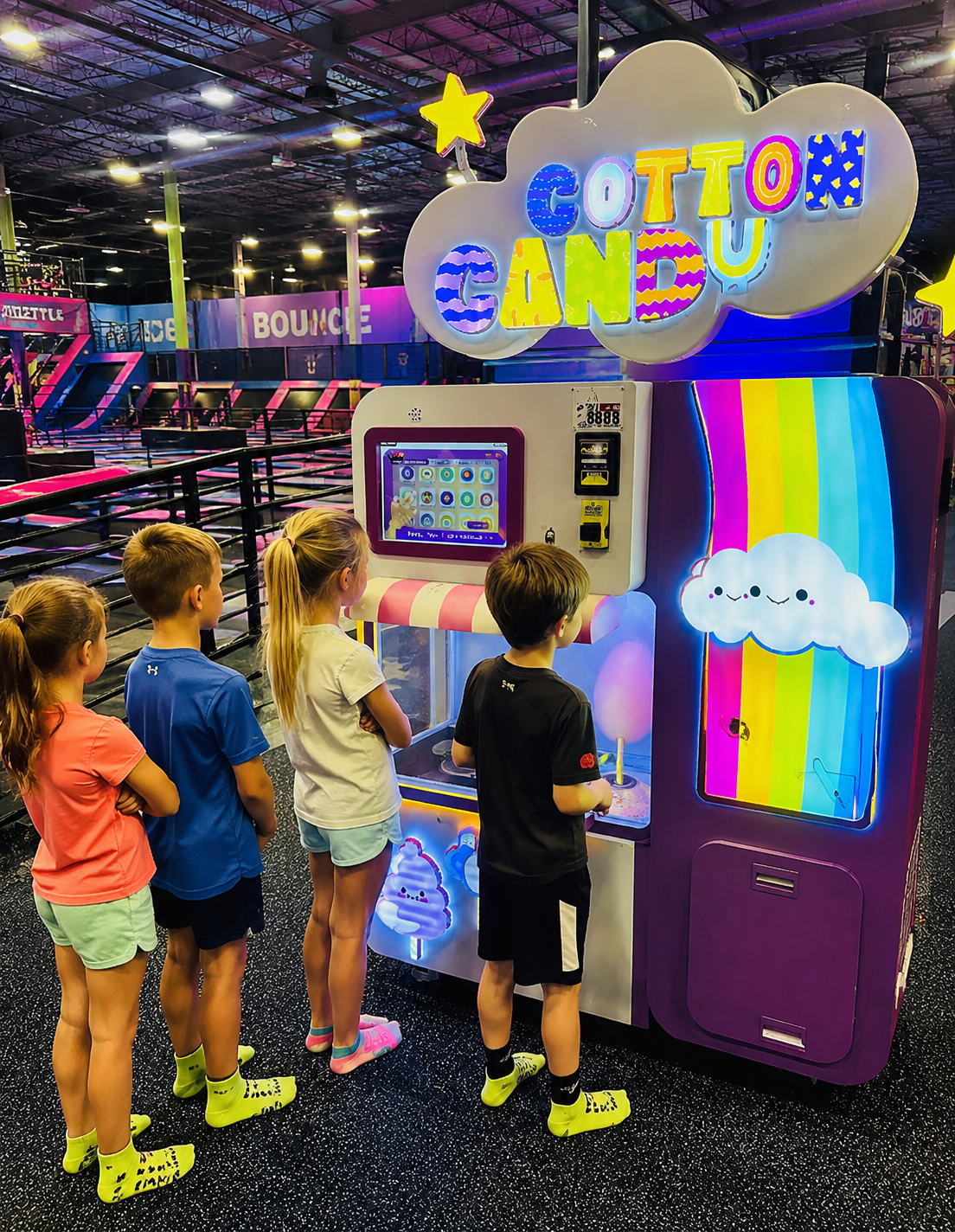 Kids at the cotton candy kiosk in a trampoline park